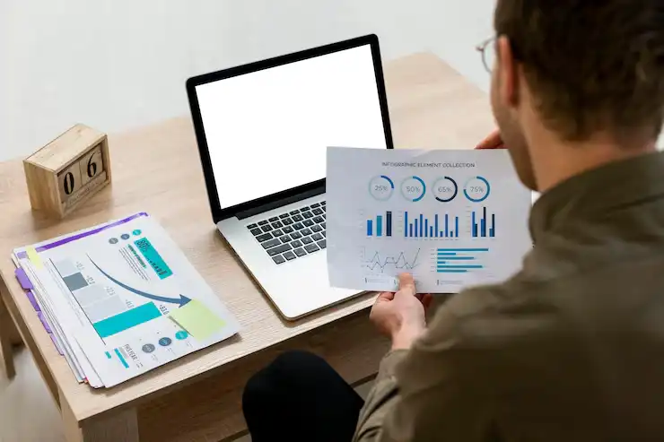 man-working-with-infographics-indoors_23-2148816826